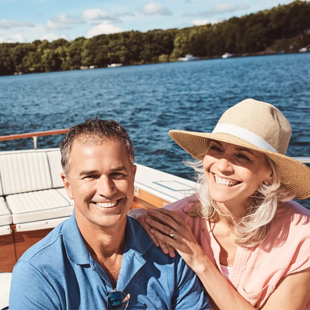 happy couple riding in a boat