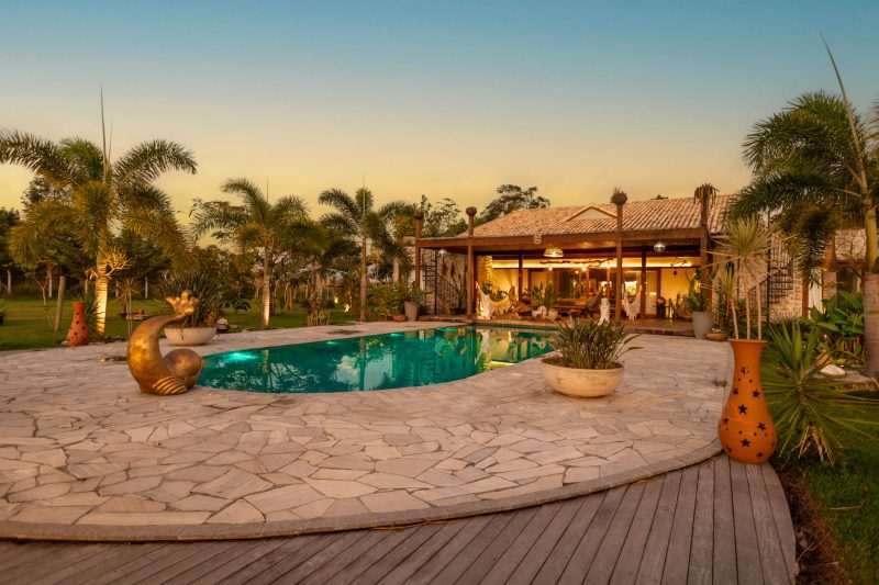 Home 8 Tranquil backyard with a pool palm trees and a cozy house at 1776790857
