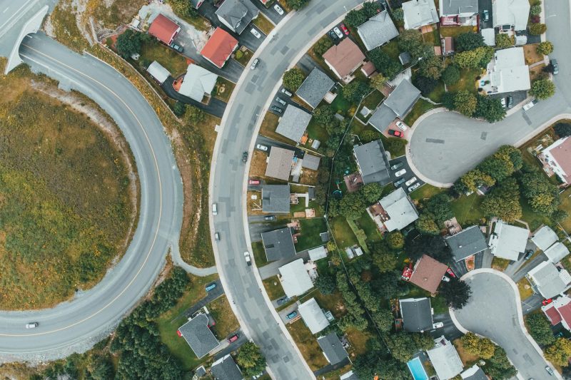 Home 4 Aerial view of a suburban neighborhood with curved roads and 1779210070