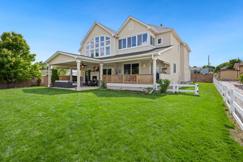Beautiful twostory suburban house with a large green lawn an 1783443846