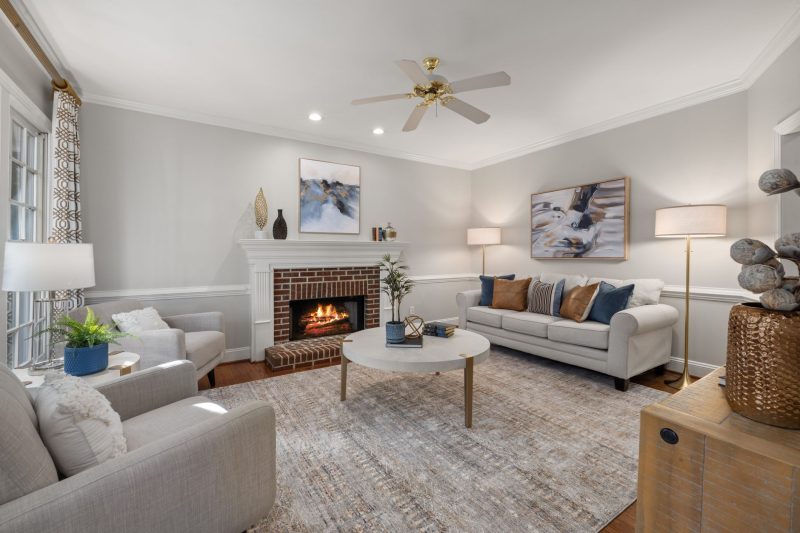 A cozy modern living room featuring a fireplace elegant sofa 1788282050