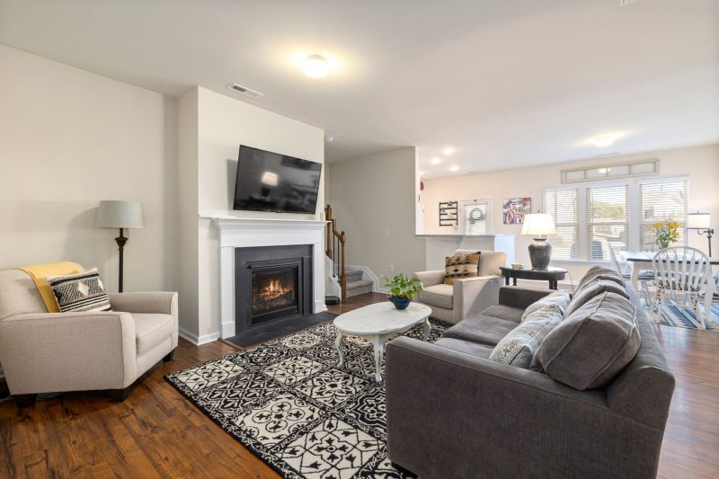 Home 9 Spacious living room featuring a fireplace TV and comfortabl 1790701286